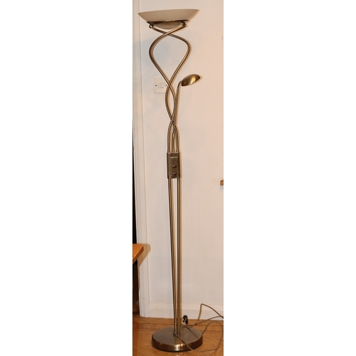 1062 - A modern floor lamp on circular metallic base with large metallic and frosted glass shade and small ... 