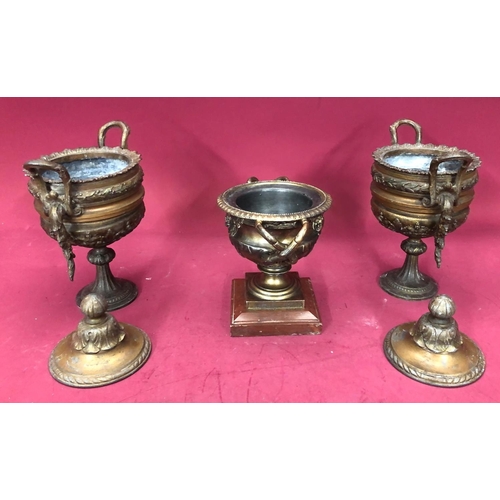 1240 - A pair of spelter lidded urns, 27cm high overall and a spelter censor, 16cm high. (3)