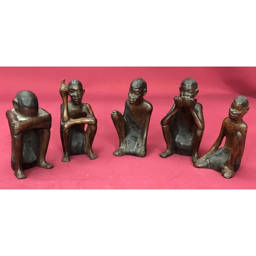 1252 - A group of African carved wood figures. (5)