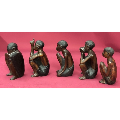 1252 - A group of African carved wood figures. (5)