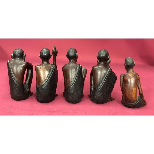 1252 - A group of African carved wood figures. (5)