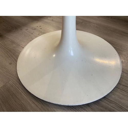 1299 - A white Arkana 1970's circular topped table, 105cm diameter and 4 chairs. This Lot is not held by PF... 