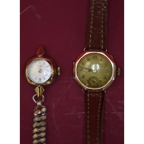 573 - A ladies' 9ct gold circular wristwatch with chamfer decoration, seconds dial and Arabic numerals, le... 