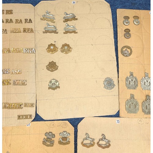 844 - A quantity of various military and other cap badges etc mounted on 10 boards