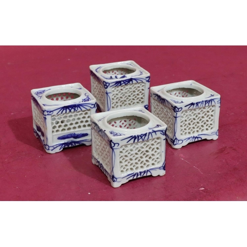 102 - 4 Oriental small square blue and white pots with pierced decoration, 6.7cm wide (4)