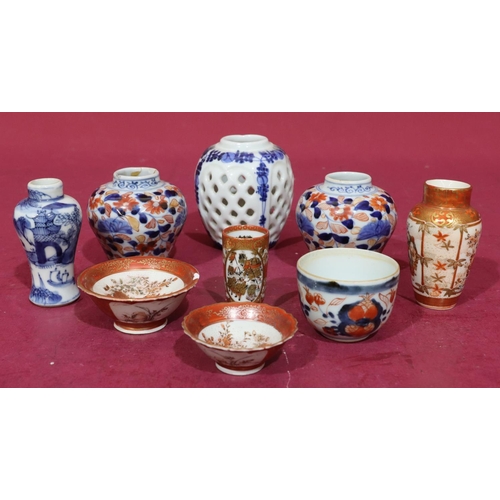 103 - An Imari round tea bowl on white, red and blue ground with floral and leaf decoration, 4.5cm high, a... 