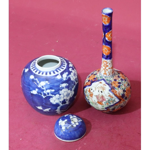 105 - An Imari round bulbous thin neck vase with multicoloured figure, floral and leaf decoration, 25cm hi... 