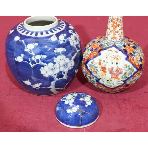 105 - An Imari round bulbous thin neck vase with multicoloured figure, floral and leaf decoration, 25cm hi... 