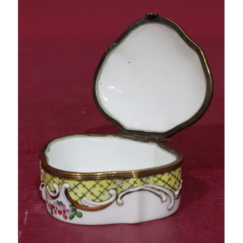 119 - A Continental scallop shaped china snuff box with hinged lid and allover raised and painted floral a... 