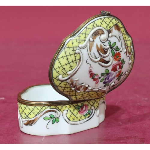 119 - A Continental scallop shaped china snuff box with hinged lid and allover raised and painted floral a... 