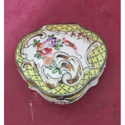 119 - A Continental scallop shaped china snuff box with hinged lid and allover raised and painted floral a... 