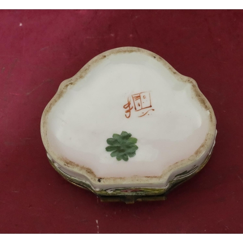 119 - A Continental scallop shaped china snuff box with hinged lid and allover raised and painted floral a... 