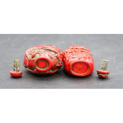 124 - 2 Oriental red snuff bottles with raised dragon and figure decoration (2)