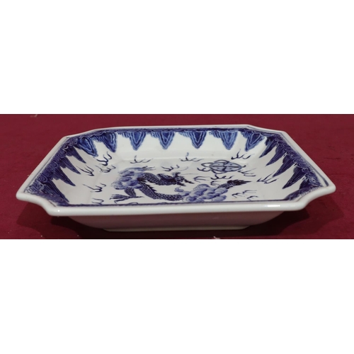 126 - An Oriental square blue and white dish with dragon motif, 25.5cm wide