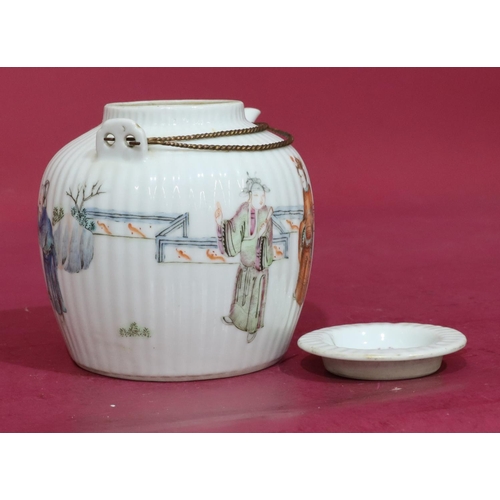 132 - An Oriental round bulbous reeded teapot on white ground with multicoloured Oriental figure and fence... 