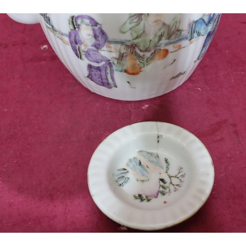 132 - An Oriental round bulbous reeded teapot on white ground with multicoloured Oriental figure and fence... 