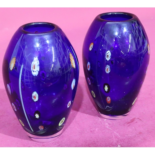 133 - A pair of of millefiori style bulbous shaped vases on blue ground with coloured decoration, 20cm hig... 