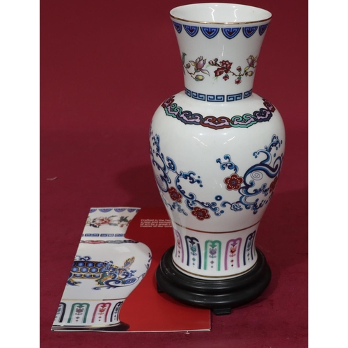 135 - A modern bone china round bulbous thin neck trumpet shaped vase 