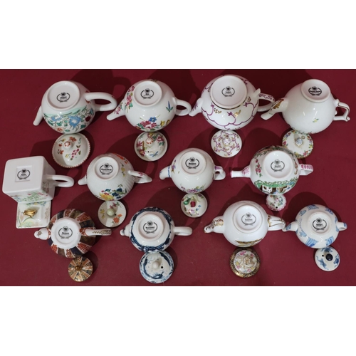 136 - 12 modern reproduction teapots after Royal Worcester 