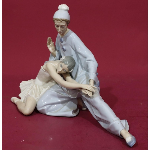 139 - A Lladro group of a seated Pierrot and Ballerina, 37cm wide, 23cm high