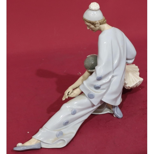 139 - A Lladro group of a seated Pierrot and Ballerina, 37cm wide, 23cm high