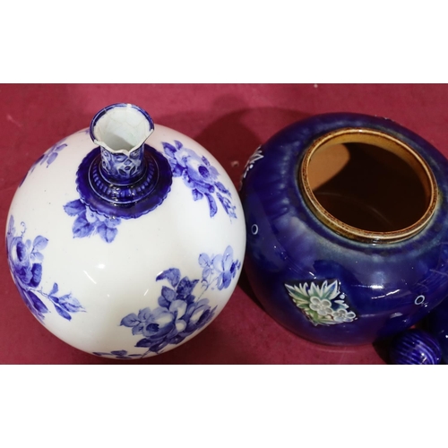 153 - A Royal Doulton glazed earthenware round bulbous shaped potpourri with pierced cover on blue ground ... 