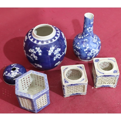 154 - An Oriental round bulbous thin neck vase on blue and white ground with branch and blossom decoration... 