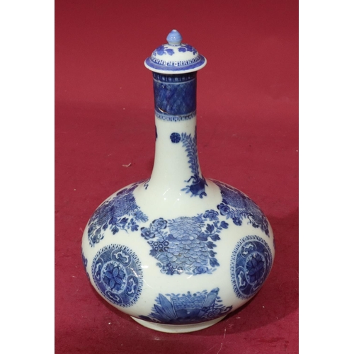 155 - A Blue and white round bulbous thin neck vase with stopper with allover floral, leaf and scroll deco... 