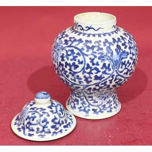 156 - A 19th Century Chinese round bulbous thin neck lidded pot on blue and white ground with allover flor... 