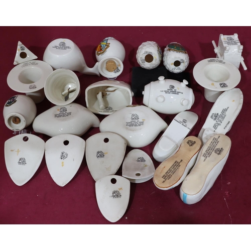 168 - 23 W.H Goss crested china oil lamps, shoes, sedan and chair, pine cones, Welsh hats etc. (23)