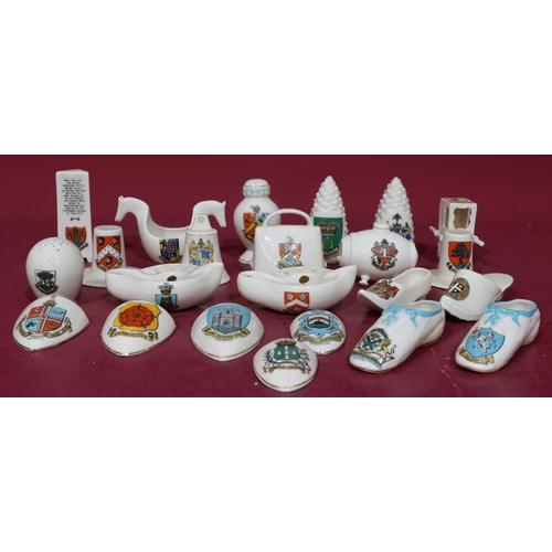 168 - 23 W.H Goss crested china oil lamps, shoes, sedan and chair, pine cones, Welsh hats etc. (23)