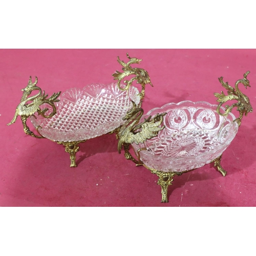 175 - 2 oval glass dishes on gilt frames with raised bird and scroll decoration on splayed feet (glass bow... 