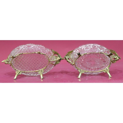 175 - 2 oval glass dishes on gilt frames with raised bird and scroll decoration on splayed feet (glass bow... 