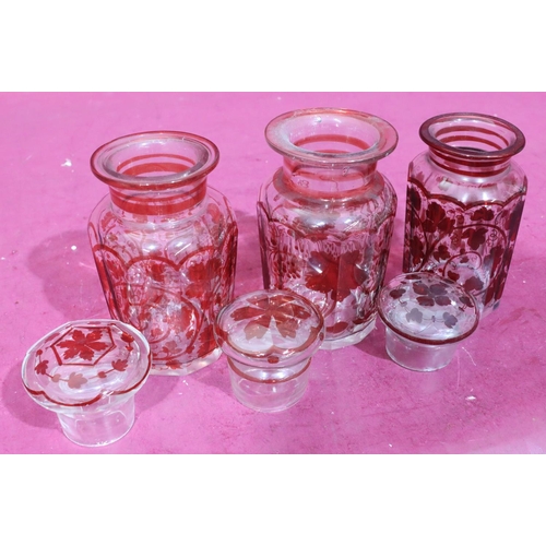 177 - 3 similar clear and red glass lidded storage jars with allover grape and vine decoration, largest, 1... 