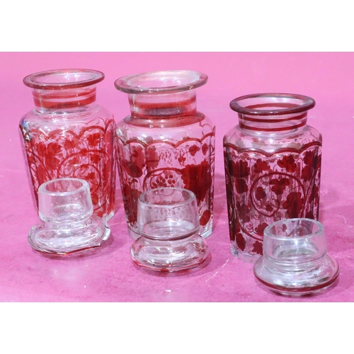 177 - 3 similar clear and red glass lidded storage jars with allover grape and vine decoration, largest, 1... 