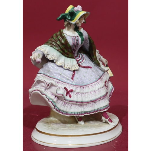 183 - A Continental china figure of a seated lady in lilac dress on oval base, 26cm high