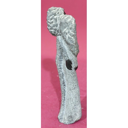 184 - A Shona style grey and black fleck stone group of 2 standing females, 42cm high