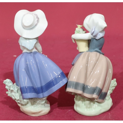 198 - 2 Lladro figures of ladies holding encrusted floral baskets, 18cm high