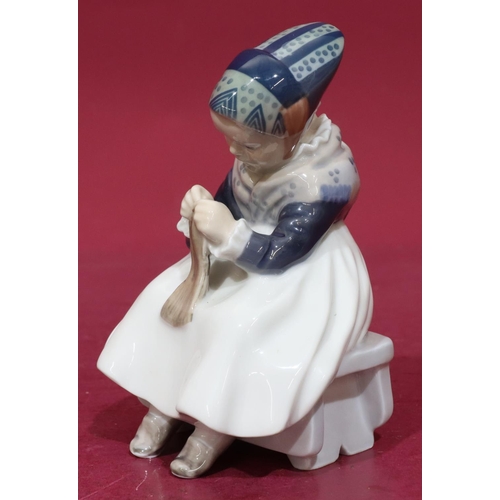 200 - A Royal Copenhagen figure of a young seated girl knitting, no. 1314, 15cm high