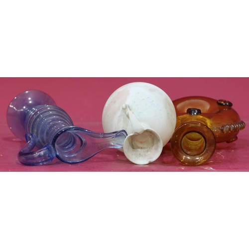 209 - An early glass bulbous shaped jug with scroll handle, 12.5cm high, a blue glass jug with raised ring... 