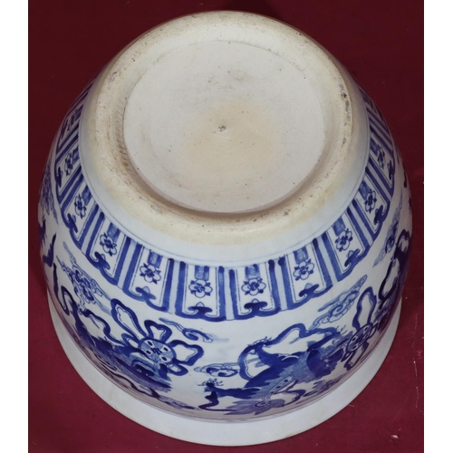 211 - A Chinese blue and white round bulbous shaped jardinière with allover dog of Pho, cloud and scroll d... 