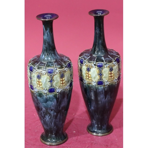 212 - A pair of Royal Doulton glazed earthenware round bulbous thin neck trumpet shaped vases on blue and ... 