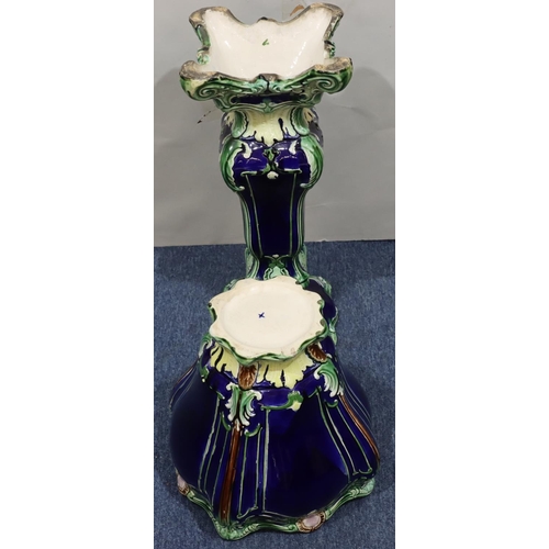 217 - A glazed earthenware square scallop shaped jardinière with matching stand on blue and green ground a... 