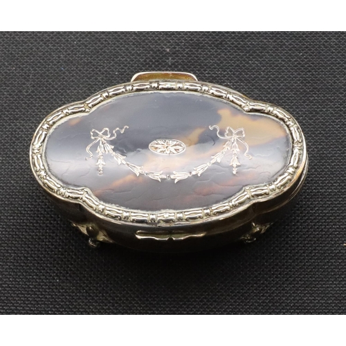 294 - A Birmingham oval scallop shaped silver trinket box with tortoiseshell hinged lid inset with swag an... 