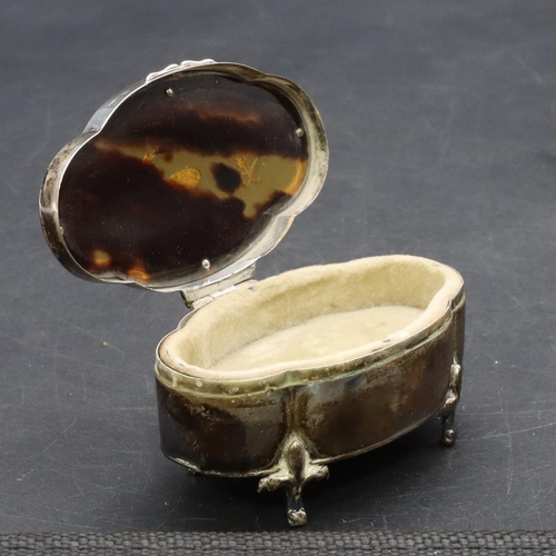 294 - A Birmingham oval scallop shaped silver trinket box with tortoiseshell hinged lid inset with swag an... 