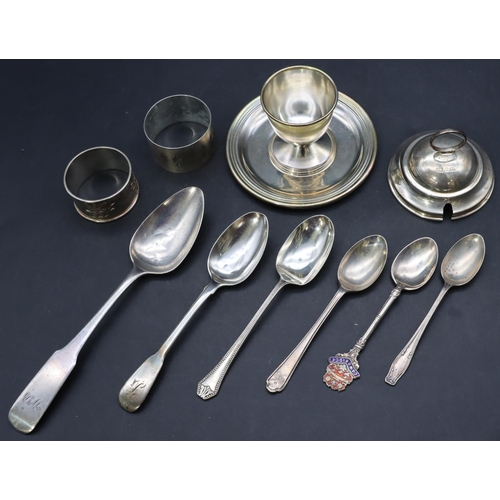 296 - A Scottish silver teaspoon, 5 other silver teaspoons, 2 silver napkin rings, a silver top and an 800... 