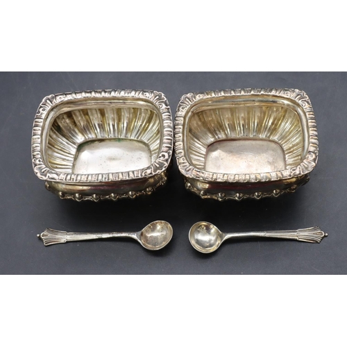 297 - A pair of Chester silver rectangular bulbous shaped salts with part embossed reeded decoration on ba... 