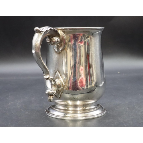 301 - An early George III silver round bulbous shaped tankard with scroll handle on sweeping foot, engrave... 