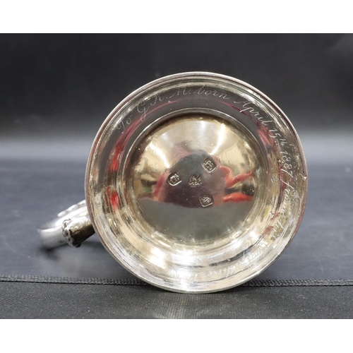 301 - An early George III silver round bulbous shaped tankard with scroll handle on sweeping foot, engrave... 