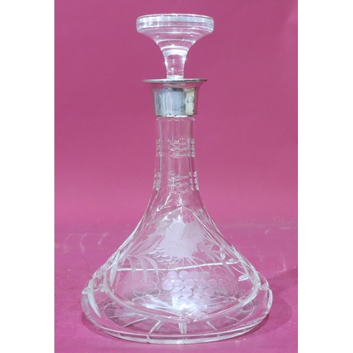 302 - A cut glass round bulbous thin neck ship decanter with stopper and London silver neck (inner part to... 